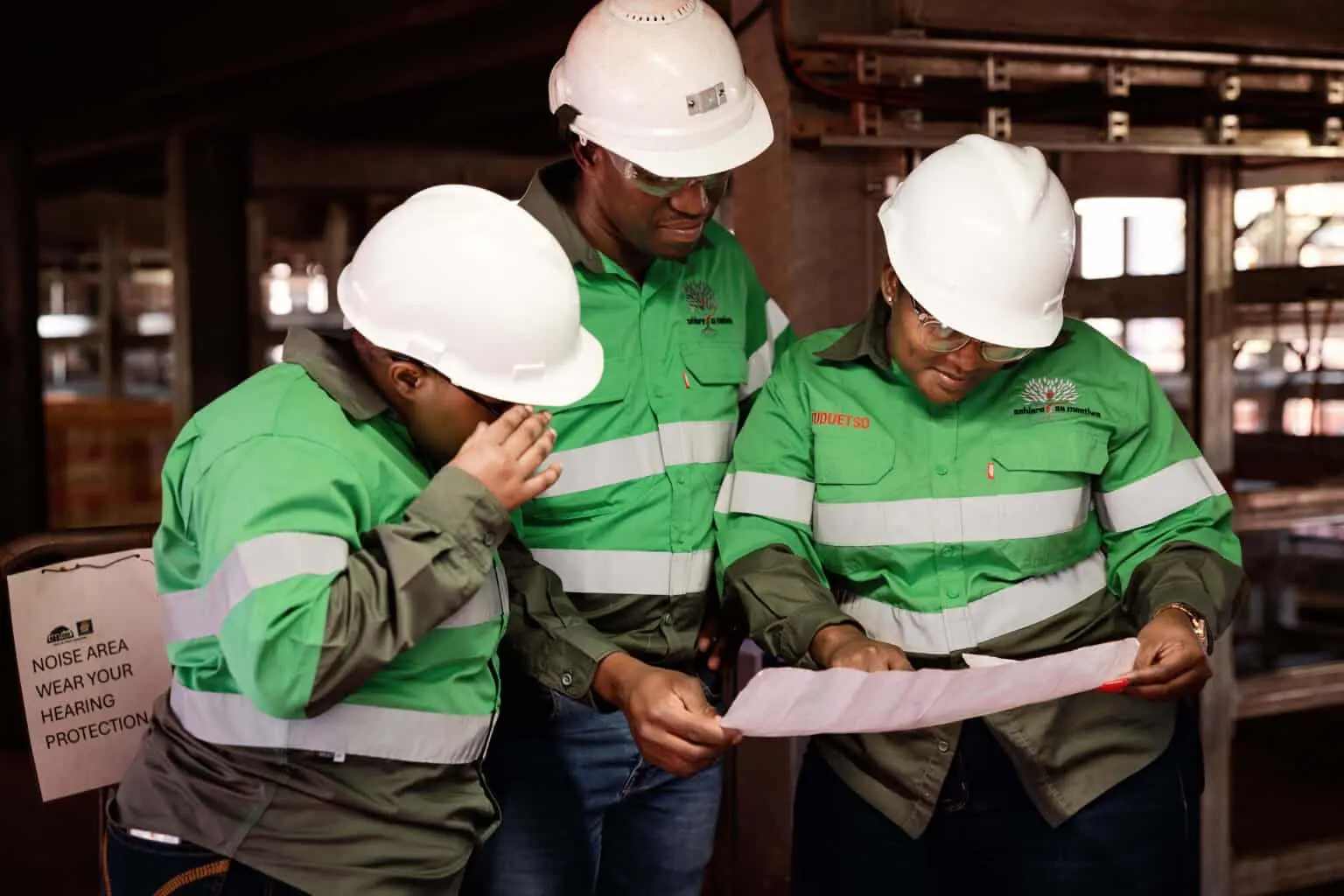 Sehlare Sa Meetlwa site team reviewing construction plans at a Northern Cape mining site